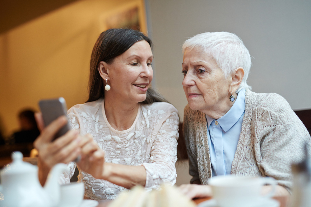 senior woman learning smartphone family help