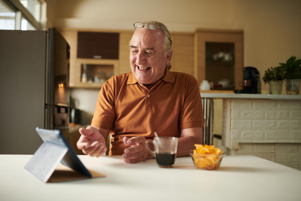 senior man smart speaker voice command kitchen